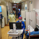A healthcare worker talks to a patient in the ER at the Oakbend Medical Center in Richmond, Texas, on July 15, 2020.